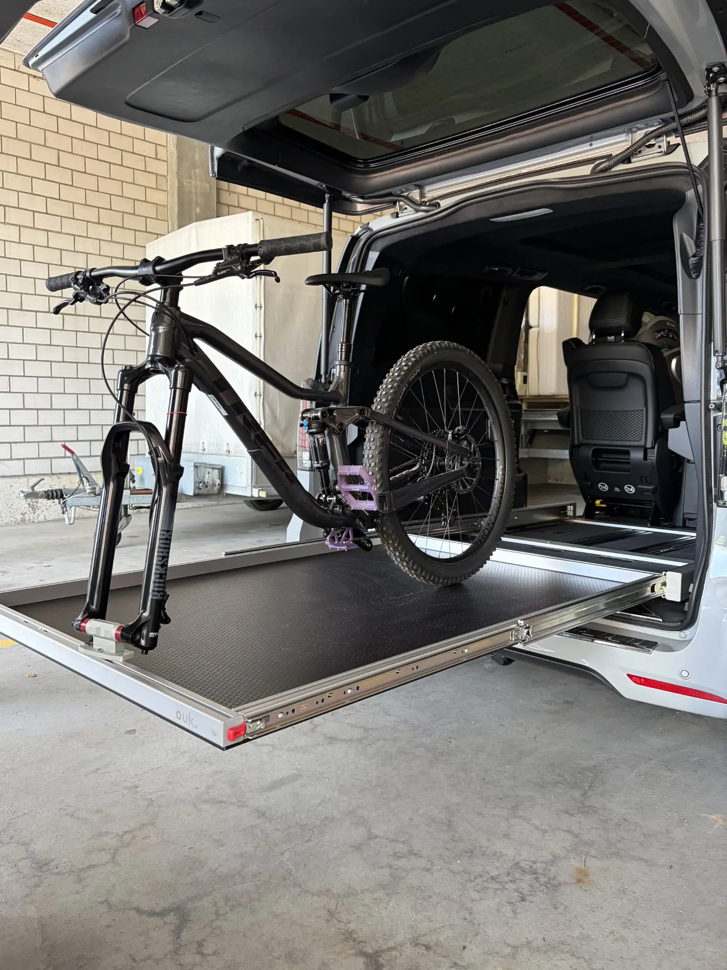 Bike transport inside vehicle - sliding tray in Mercedes V-class, installation in Basel, Switzerland